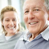 Smiling, elderly Caucasian couple
